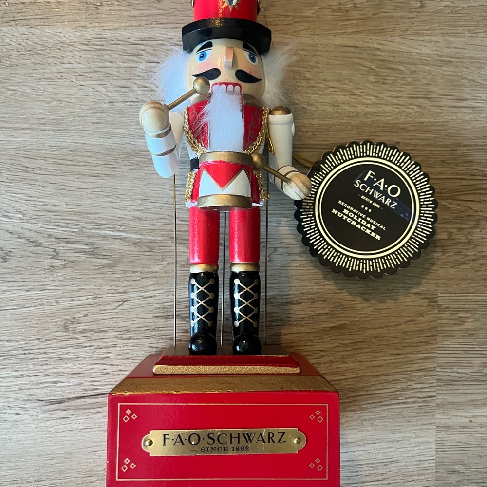 FAO Schwarz Red, White, Black and Gold Nutcracker Figurine on Red Base